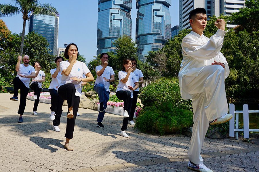 Master Chow Chin Ching practicing Tai Chi with his students